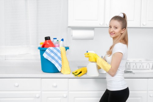Technician using PPE during carpet cleaning in a property