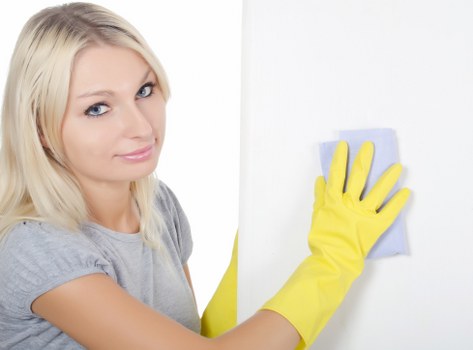 Professional carpet cleaner treating a stain during service